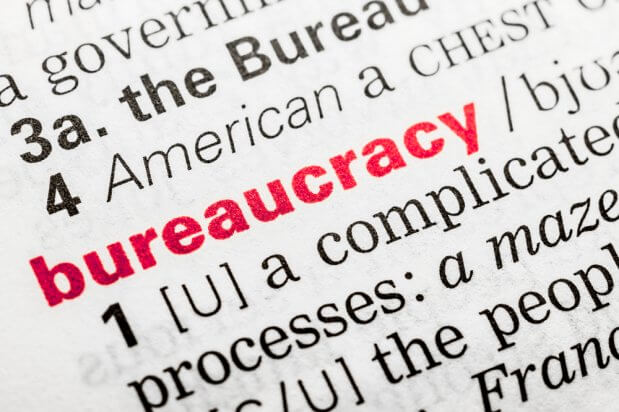 zoomed in picture of bureaucracy in the dictionary