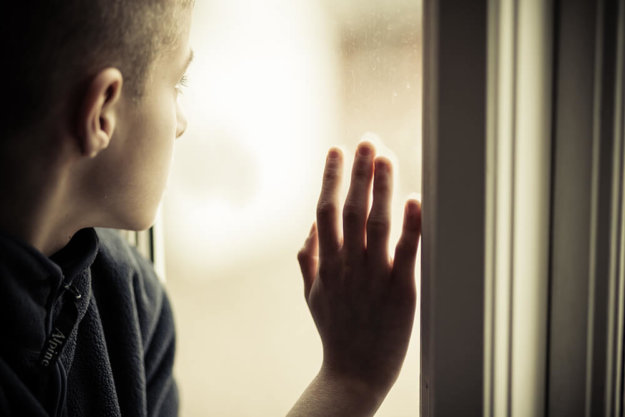 a teen puts his hand on the window as the defiant teen gets life back on track