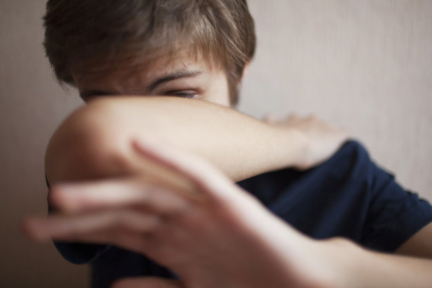 panicking boy dealing with types of mental illness