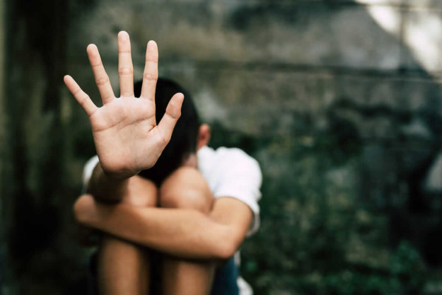 little boy with hands up signs of inhalant abuse