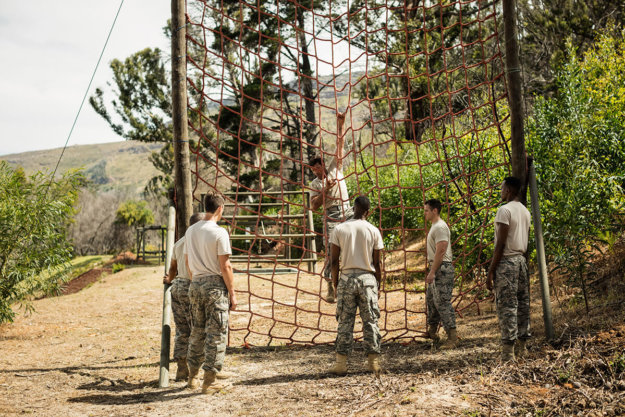 teenage boys in camo pants getting benefits of boot camp