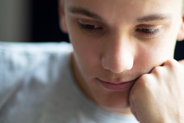 young person thinking about Self-Harm and Teens