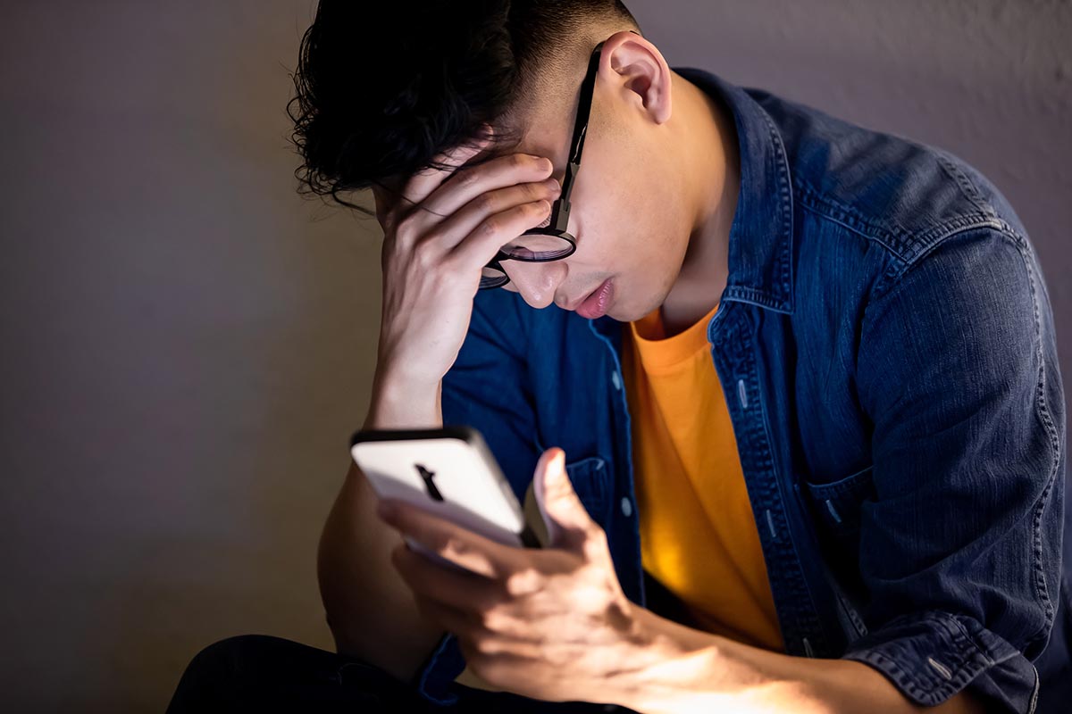 boy dealing with cyberbullying